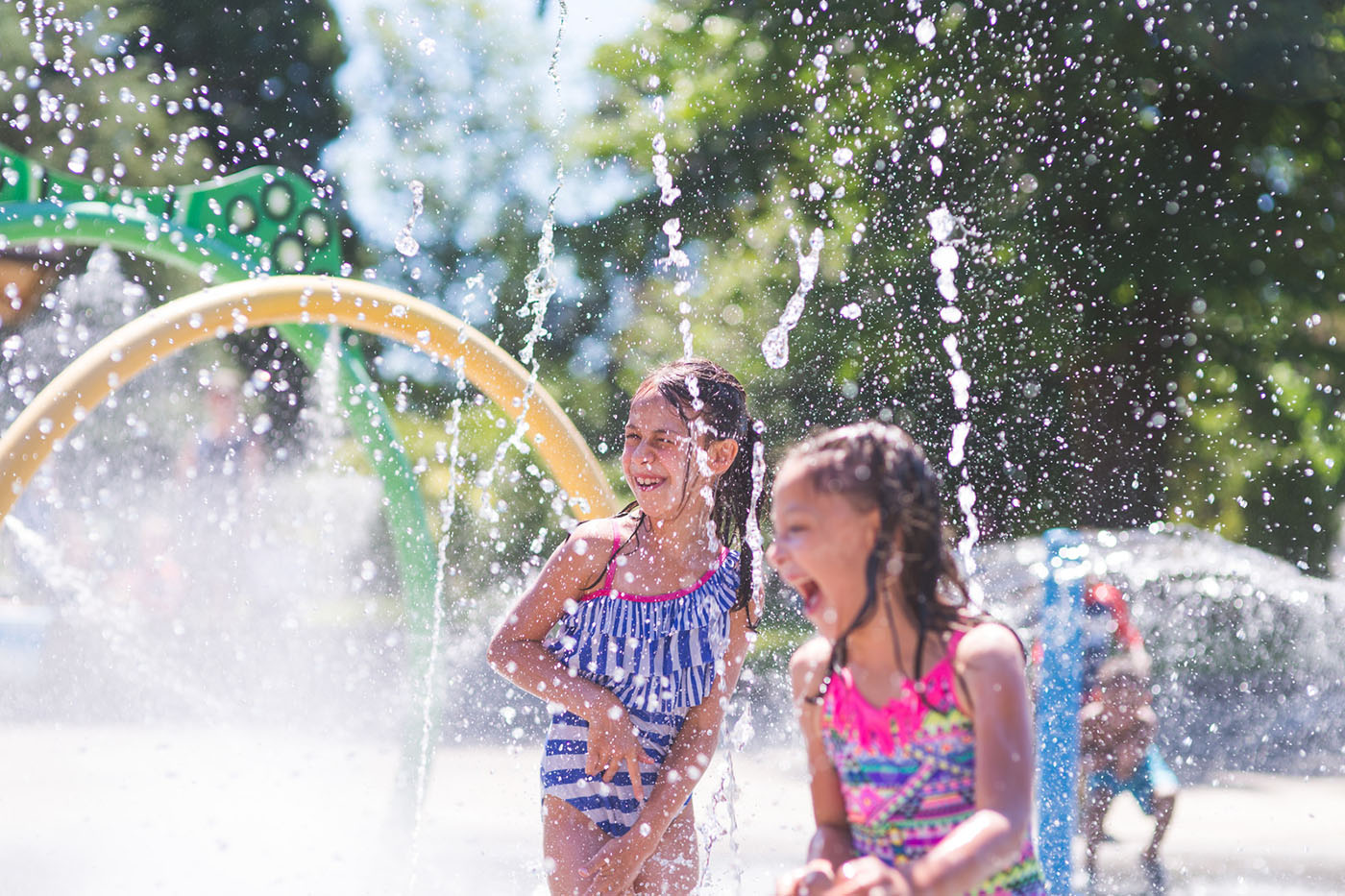 kids playing on splash pad