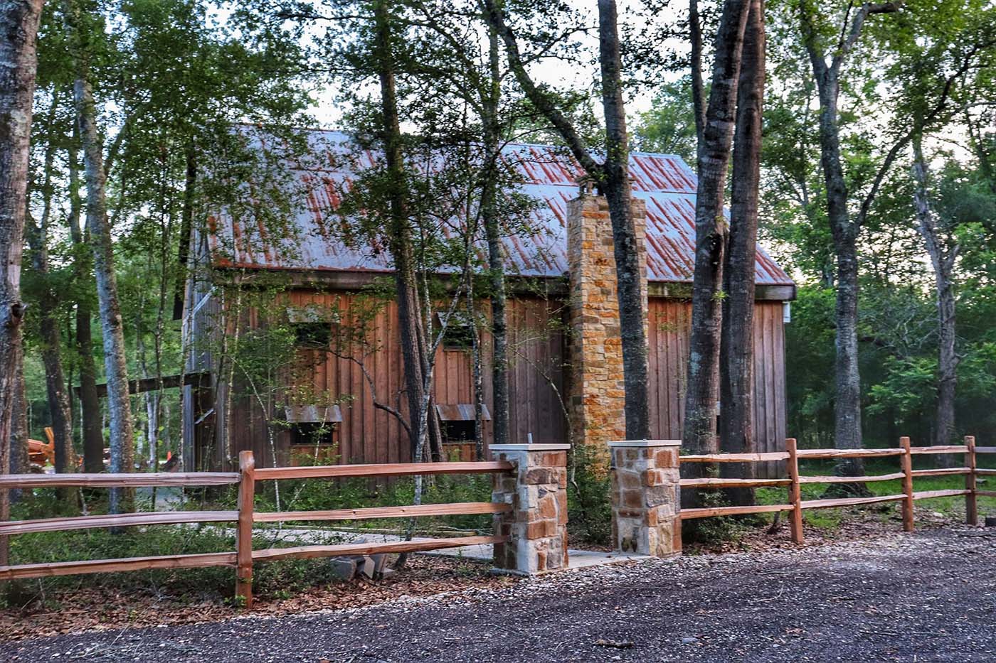 barn with fence and trees
