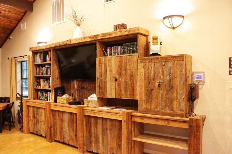 cabinets, television, and books inside rec room