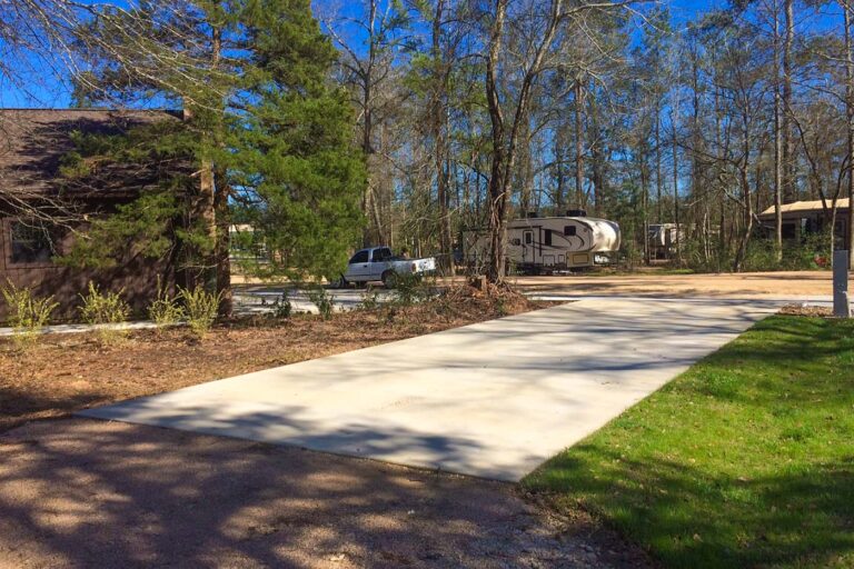 concrete rv pad with grass and trees