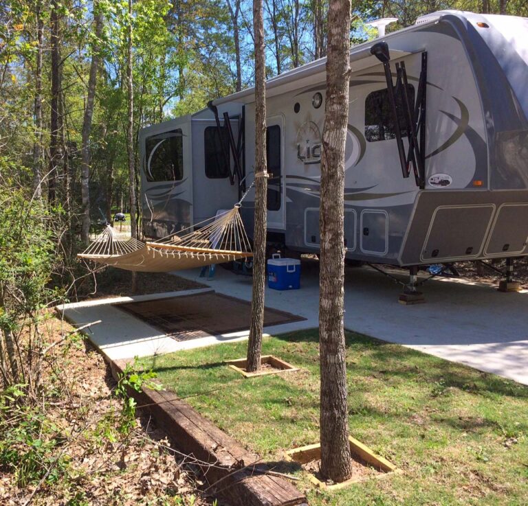 rv parked with hammock
