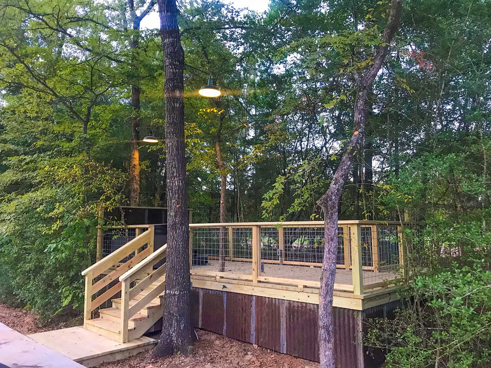 private deck surrounded by trees